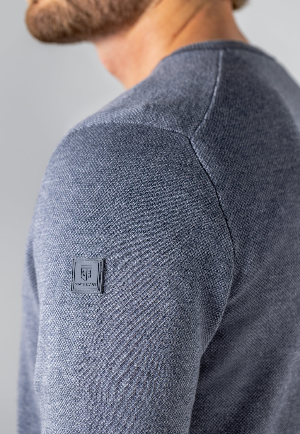 Pull Oxford à badge en caoutchouc