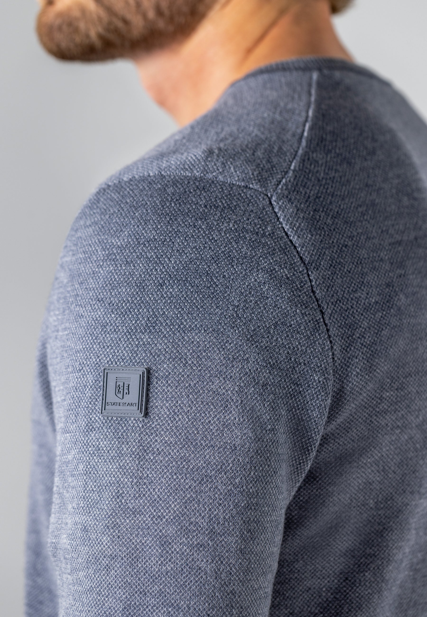 Oxford trui met rubberen badge