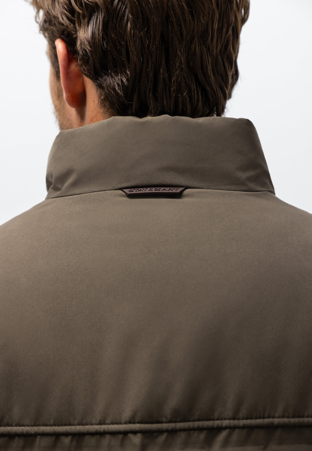 Veste avec badge en caoutchouc
